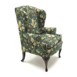 Queen Anne style wing back upholstered armchair, cabriole legs,