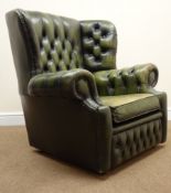 Vintage Chesterfield club chair upholstered in deep buttoned green leather,