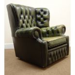 Vintage Chesterfield club chair upholstered in deep buttoned green leather,