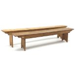 Two waxed pine benches, solid end supports (W236cm, H48cm and W205cm,