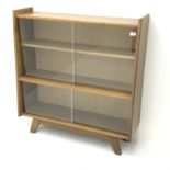 Light oak bookcase, sliding glass doors enclosing two shelves, W101cm, H108cm,