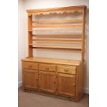 Solid pine dresser, raised back two tier plate rack above three drawers and cupboards, W138cm,