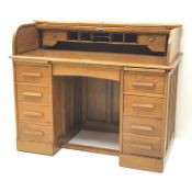 Early 20th century light oak twin pedestal tambour roll top desk, fitted interior, two slides,