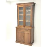 Edwardian walnut bookcase on cupboard, projecting cornice,