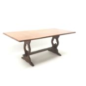 Oak refectory style dining table, pierced and shaped solid end supports joined by stretchers,