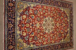 Najaf Abad red ground rug, central medallion, repeating border,