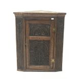 19th century heavily carved oak wall hanging corner cupboard, single door, W86cm, H106cm,