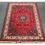 Persian style red ground rug,