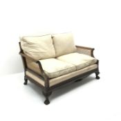 Early 20th century walnut two seat Bergere sofa, scrolled arms,