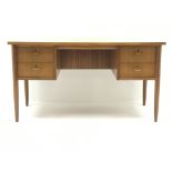 Mid 20th century retro teak desk, four drawers, turned supports, 'Morris of Glasgow', W137cm, H75cm,