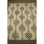 West Elm beige ground fes wool long pile rug,