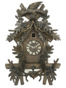 20th century Black Forest style Cuckoo clock, with carved acorn and bird cresting,