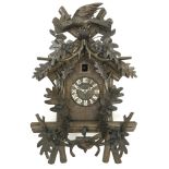 20th century Black Forest style Cuckoo clock, with carved acorn and bird cresting,