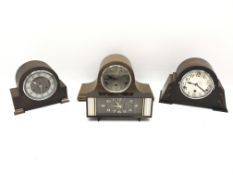 Two 20th century oak cased mantel clocks with three train movements chiming on rods,