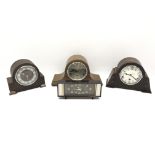 Two 20th century oak cased mantel clocks with three train movements chiming on rods,