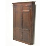 Late 18th century oak double corner cupboard,