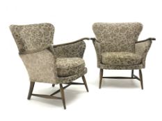 Pair Parker Knoll armchairs, upholstered in a patterned beige fabric,