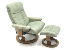 Ekornes Stressless leather upholstered reclining arm chair and stool (2) Condition Report