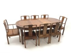 Eastern style mahogany circular extending dining table, square tapering supports on shaped feet,