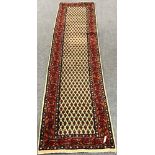 Arrak style ivory ground runner, geometric pattern field, repeating border,