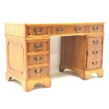 Georgian style Yew wood pedestal desk, three piece inset leather top six drawers, single cupboard,