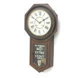 Ansonia wall clock with Roman dial and painted Guinness & Co's advertising glazed door,