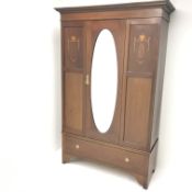 Edwardian inlaid mahogany wardrobe, single central oval mirrored door above two drawers, W131cm,