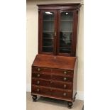 19th century mahogany bureau with bookcase top, two doors,