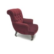 Victorian Howard style armchair, upholstered in a deep buttoned red fabric, turned supports,