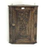 Small early 20th century carved oak corner cupboard, H56cm,