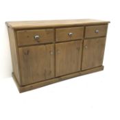 Solid pine dresser base, three drawers above three cupboard doors, two slides to side,