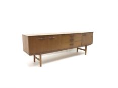 Mid 20th century Avalon teak sideboard, three graduating drawers flanked by three cupboards,