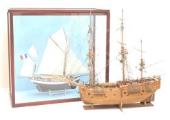 Model of a French two masted fishing boat in glazed display case, W68cm, H65cm,