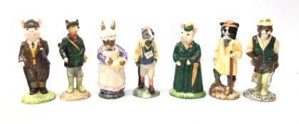 Seven John Beswick figures comprising Huntsman Fox, Gentleman Pig, The Lady Pig, Hiker Badger,