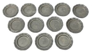 Set of twelve 19th century miniature pewter plates with waved rim,