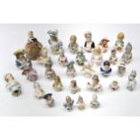 Group of thirty half pin cushion dolls of varying sizes, one with pin cushion base,
