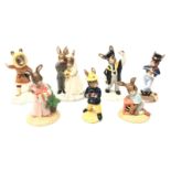 Seven Royal Doulton Bunnykins figures comprising Graduation Day, Fireman, Easter Treat, Eskimo,