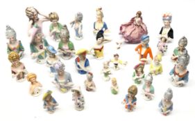 Group of thirty half pin cushion dolls of varying sizes, one with pin cushion base, L10.