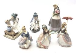 Six Lladro figures comprising 'Dutch Girl with Tulips' no. 5065, 'Angela' no. 5211, 'Jolie' no.