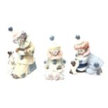 Three Lladro Clown/ Pierrot figures with Puppies, model numbers 5278,