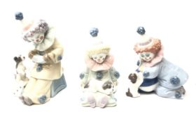 Three Lladro Clown/ Pierrot figures with Puppies, model numbers 5278,