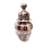 19th century Japanese Imari vase, moulded fluted body and conforming cover with globular finial,