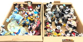 Collection of Disney Mickey Mouse and Friends figures including a large musical globe, candlesticks,