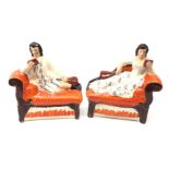 Pair Victorian Staffordshire figures of reclining musicians,