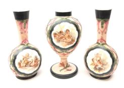 Victorian painted milk glass trio comprising two bottle shaped vases and baluster vase,