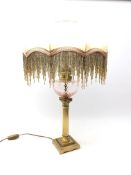 Modern Corinthian Column oil lamp style table lamp, the silk shade having beaded fringing,