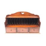 Mahogany stationary cabinet, pierced arched top,