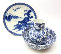Early 20th century Japanese blue and white charger decorated with cranes in a mountainous landscape