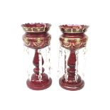 Pair of Victorian ruby glass lustre vases, each with hollow baluster stem, domed base,