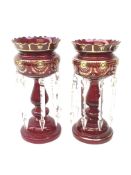 Pair of Victorian ruby glass lustre vases, each with hollow baluster stem, domed base,